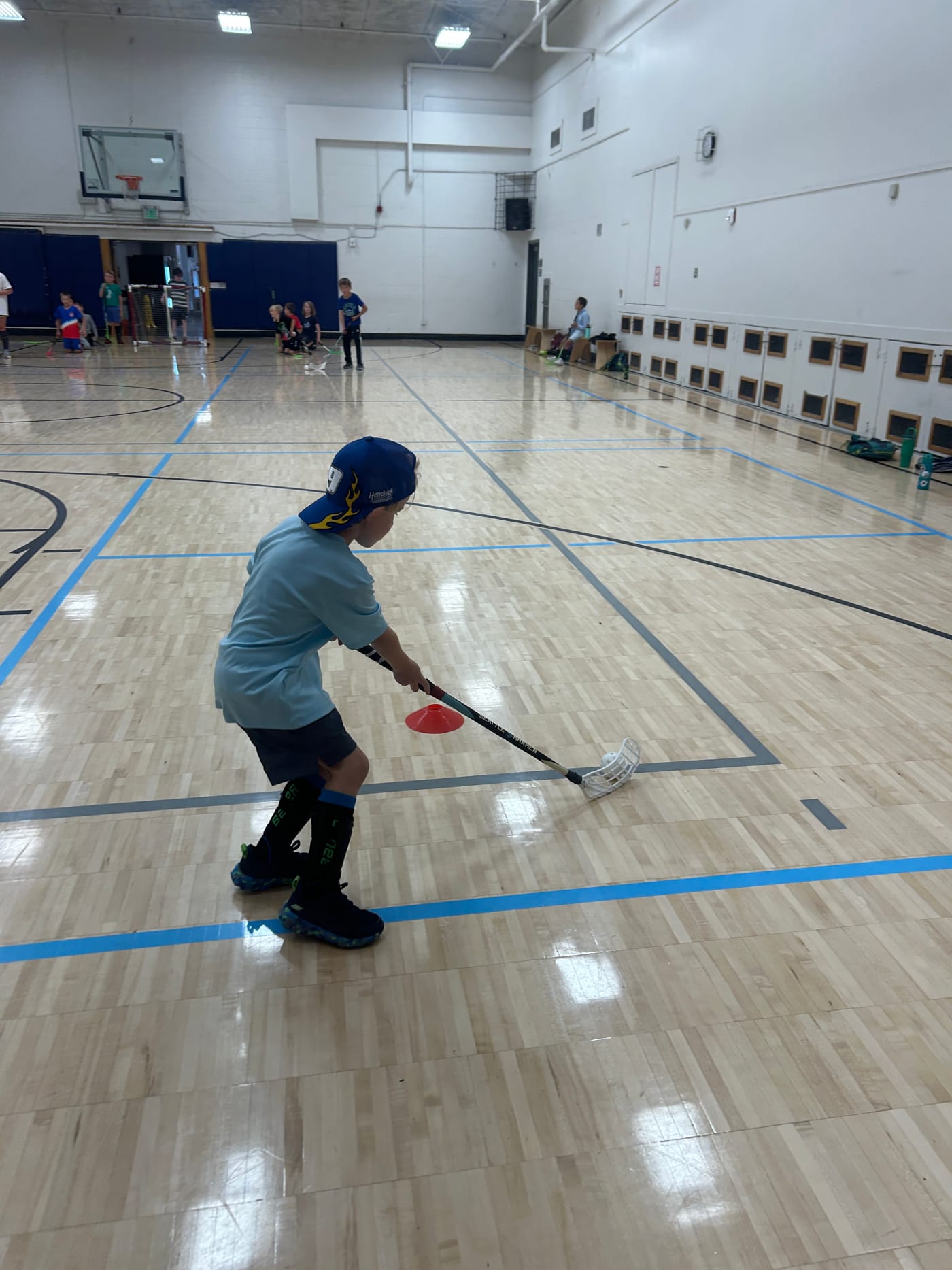 A camper working on stickhandling at Edmonds Summer Camp