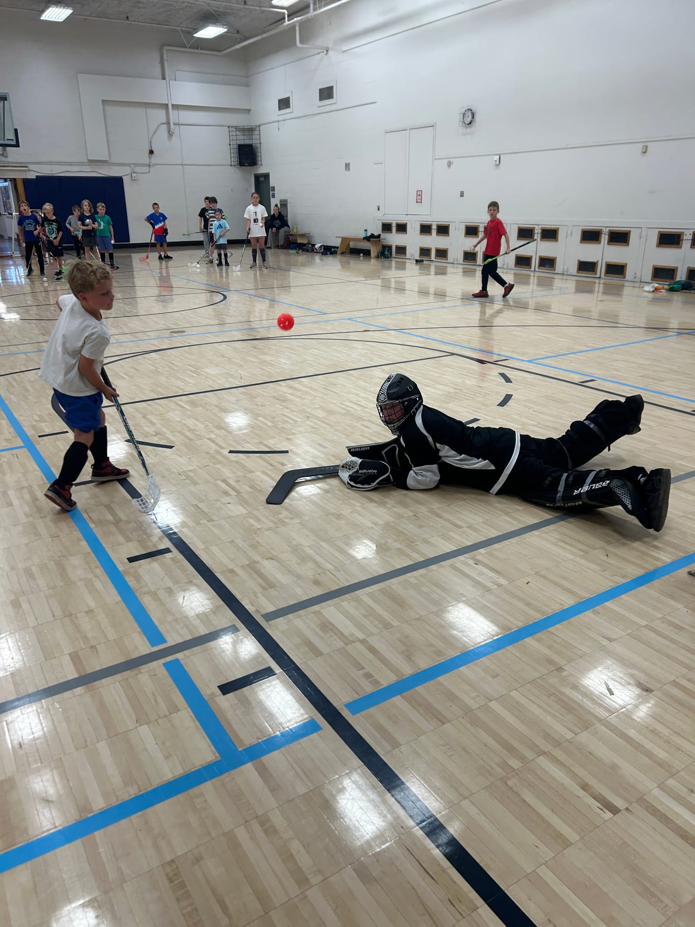 Campers playing ball hockey at Frances Anderson Center