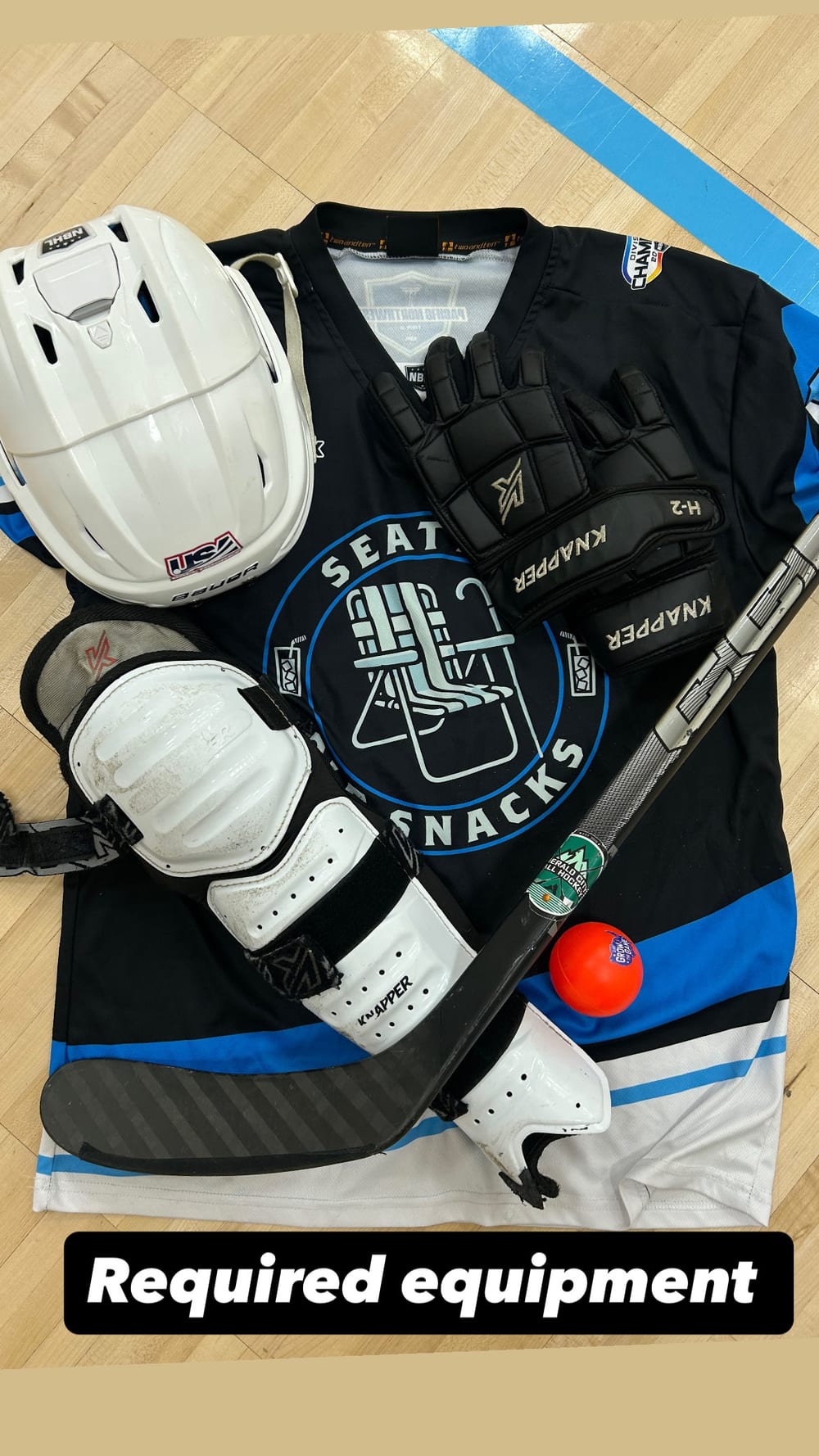Required ball hockey equipment laid out on the floor
