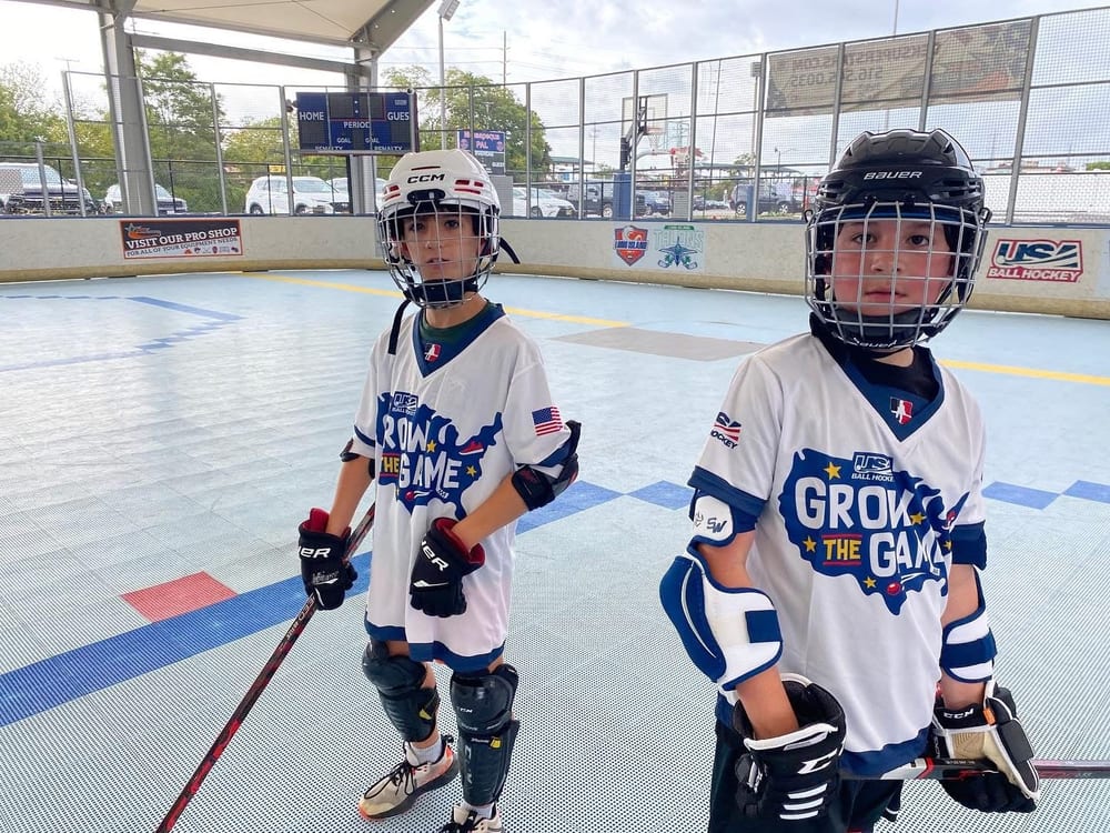 Young Emerald City Ball Hockey players in full protective gear